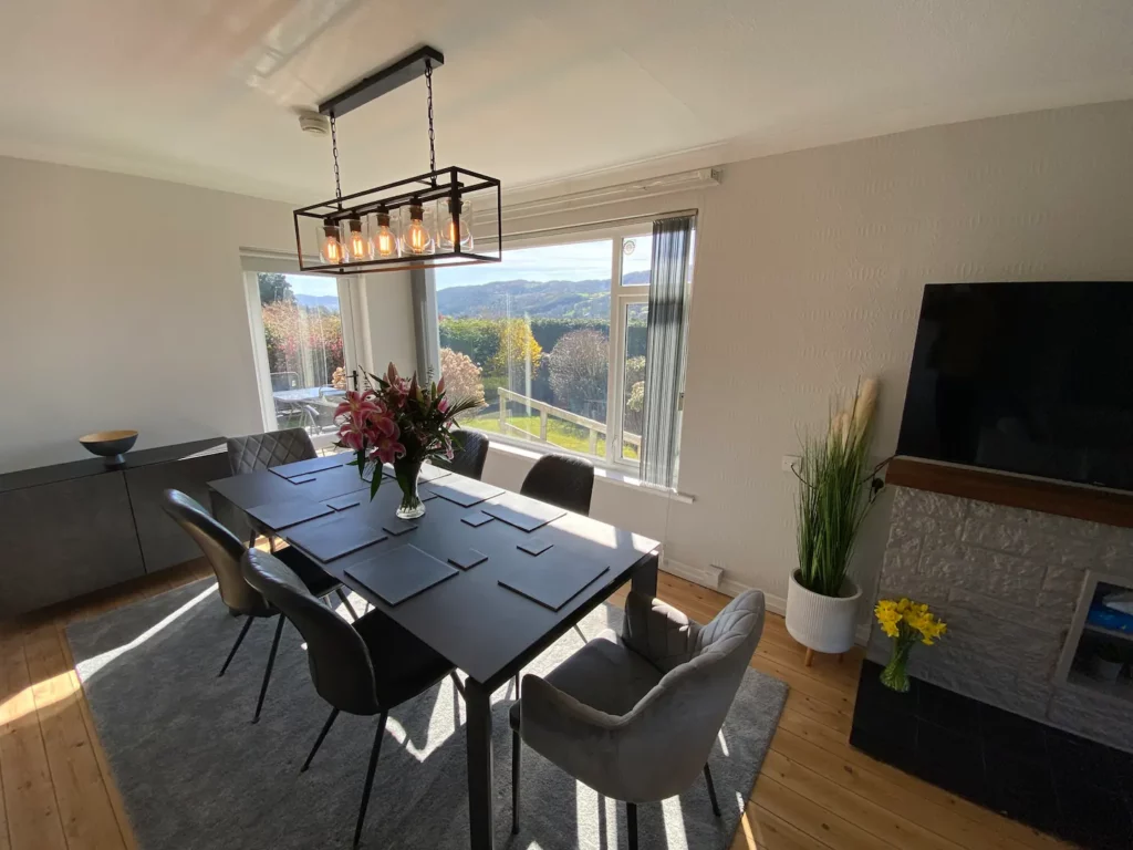 Patio door from dining area leads to back patio and outdoor dining area Patio door from dining area leads to back patio and outdoor dining area