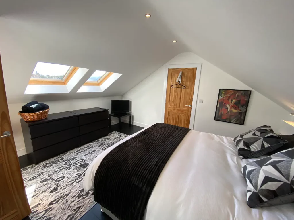 Bedroom three, first floor with velux windows Bedroom three, first floor with velux windows